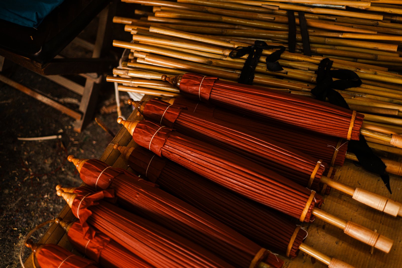 Stacked umbrella frames in deep orange tones