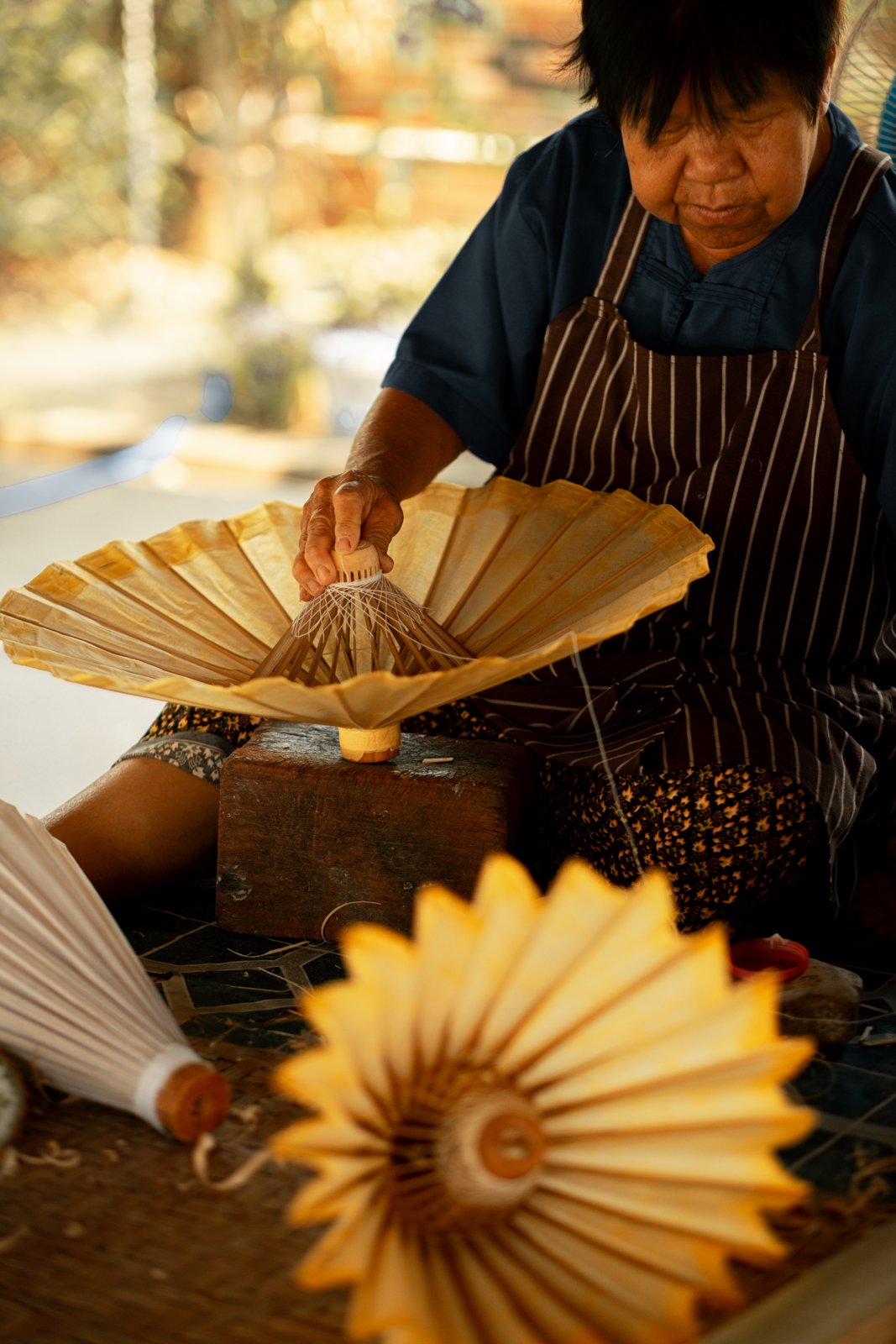 A folded paper rosette, sculptural and golden